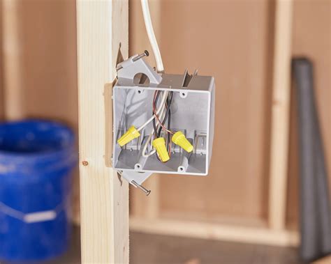 electrical box side against stud screw|screwed into electrical box.